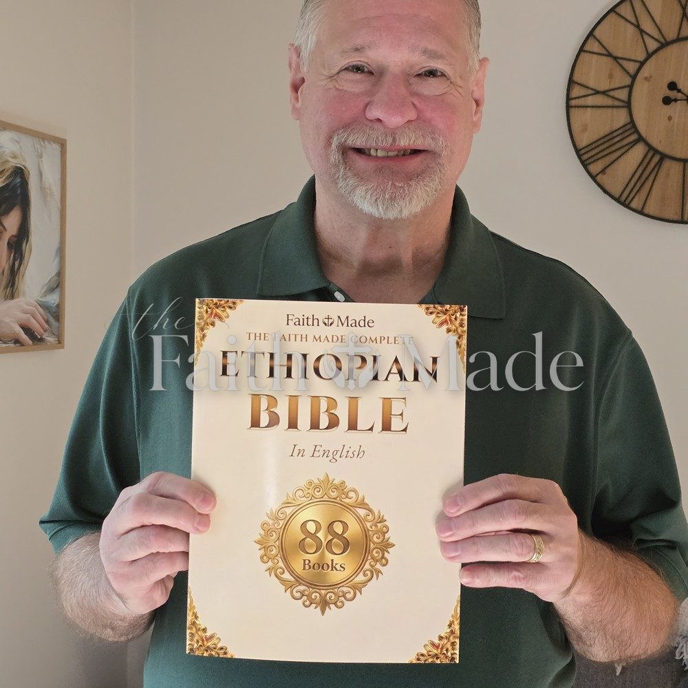 A reader holding The Faith Made Complete Ethiopian Bible